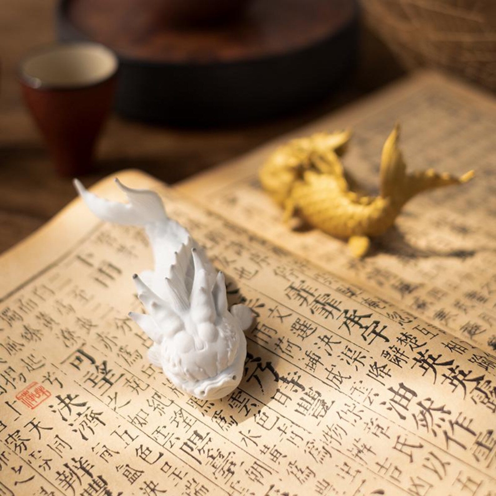 Artisan "Dragon-Koi" Ceramic Tea Pet Set — Pair of Mythical Fish Figurines (White & Gold)